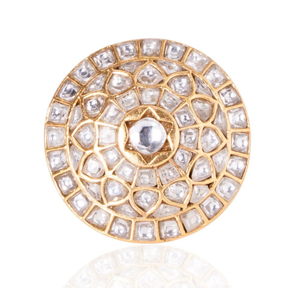 Gold and crystal decorative element on a white background