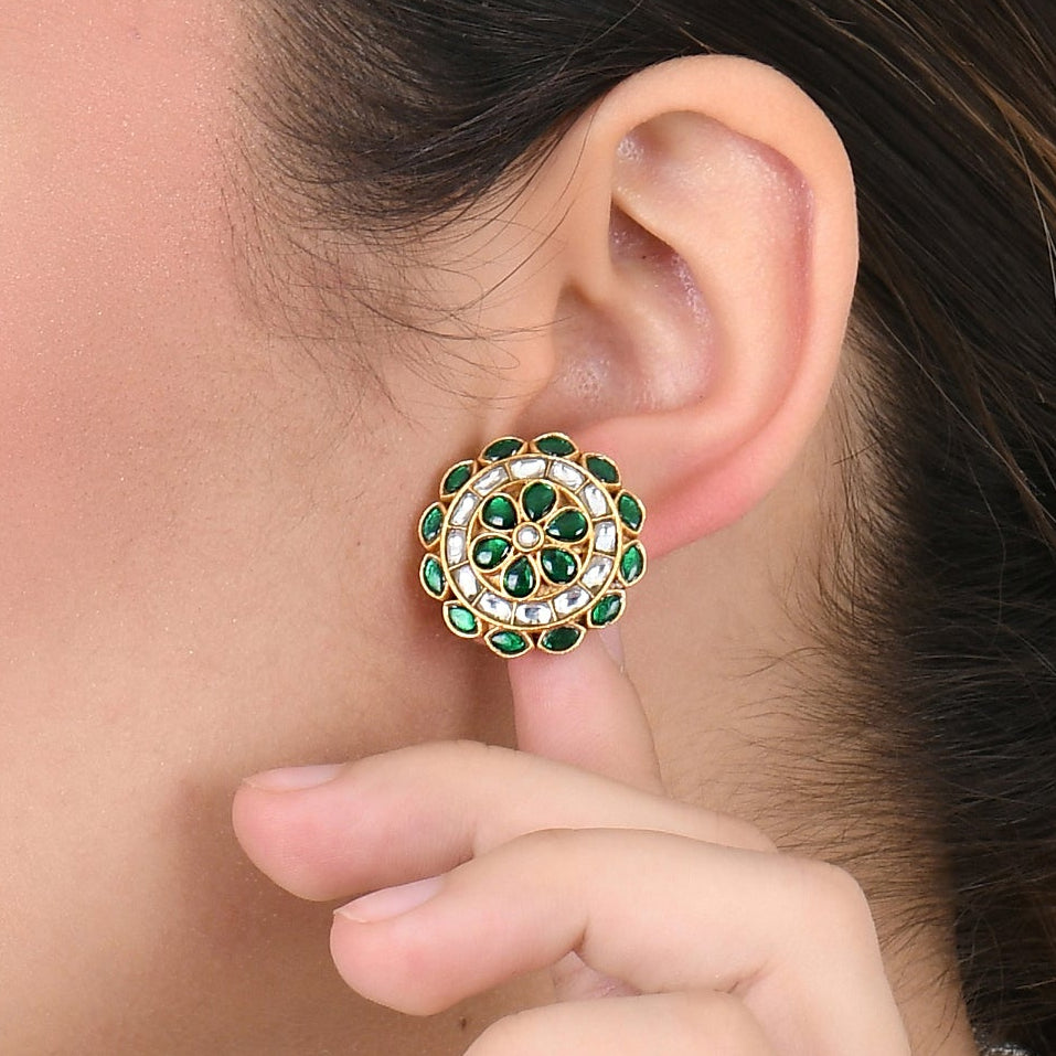 women wearing a green earring