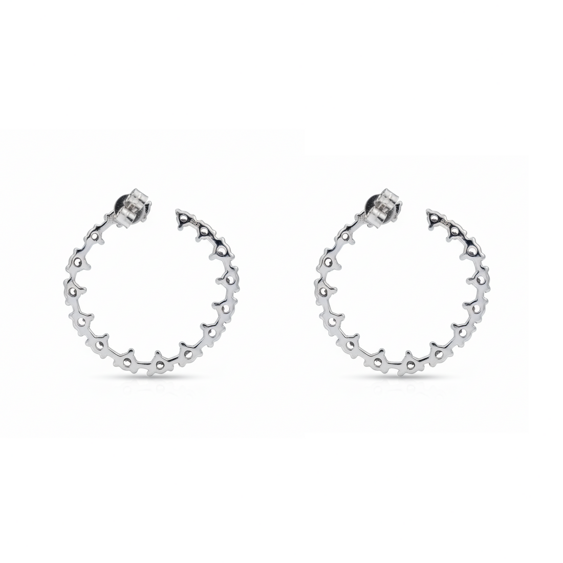 Pair of silver hoop earrings on a white background