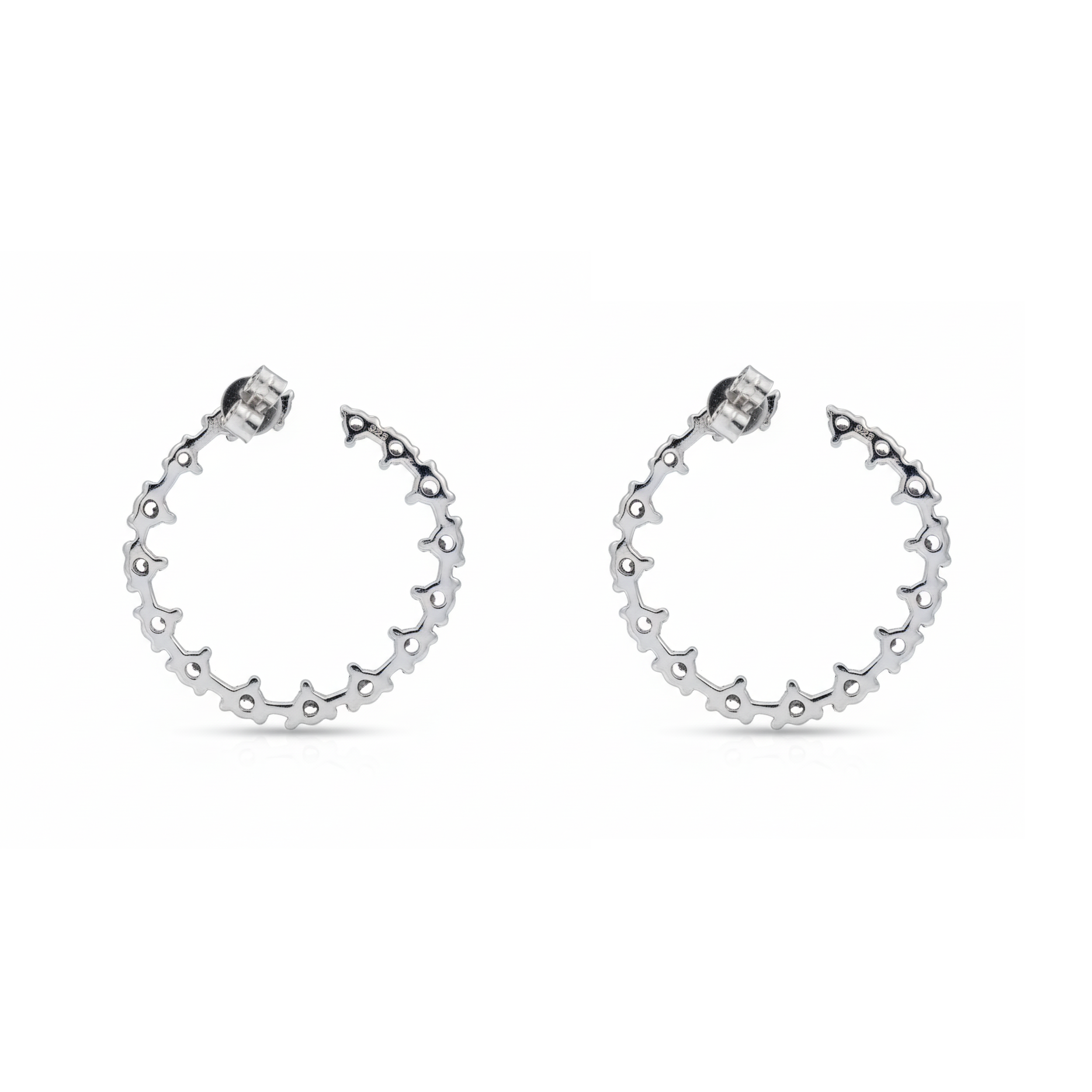Pair of silver hoop earrings on a white background