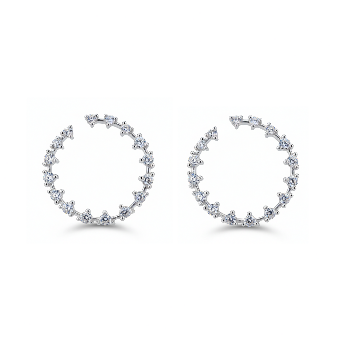 Pair of silver hoop earrings with small diamonds on a white background