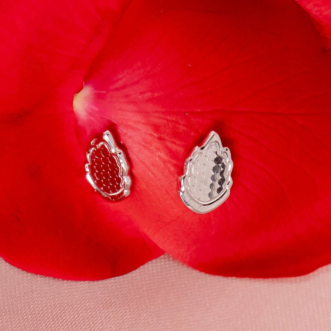 earrings on rose petal