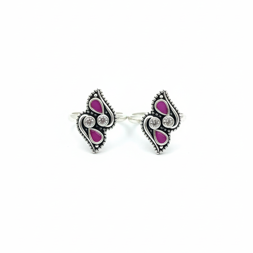 Pair of earrings with pink gemstones on a white background