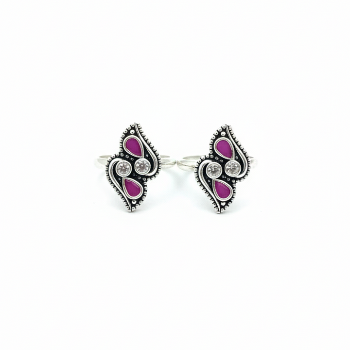 Pair of earrings with pink gemstones on a white background