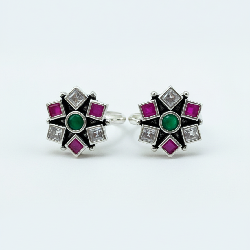 Pair of earrings with gemstones on a white background