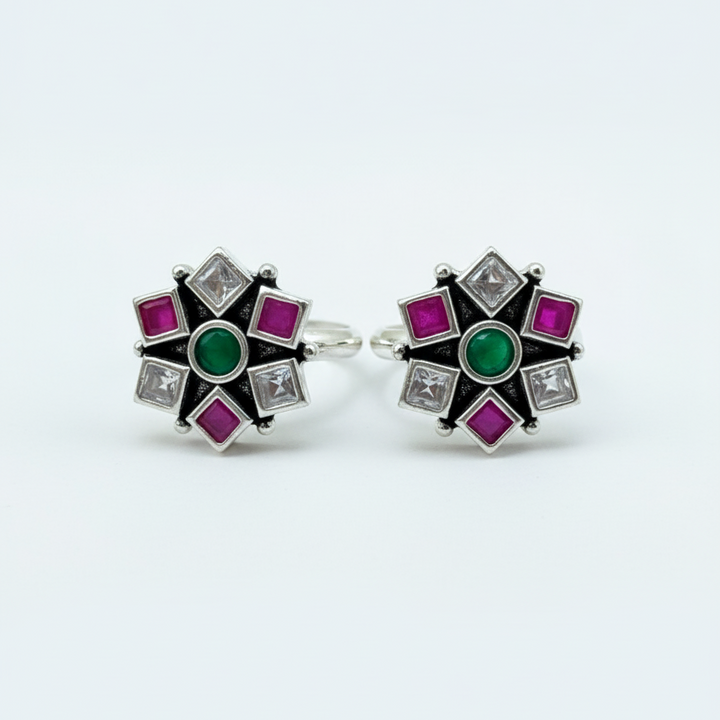 Pair of earrings with gemstones on a white background