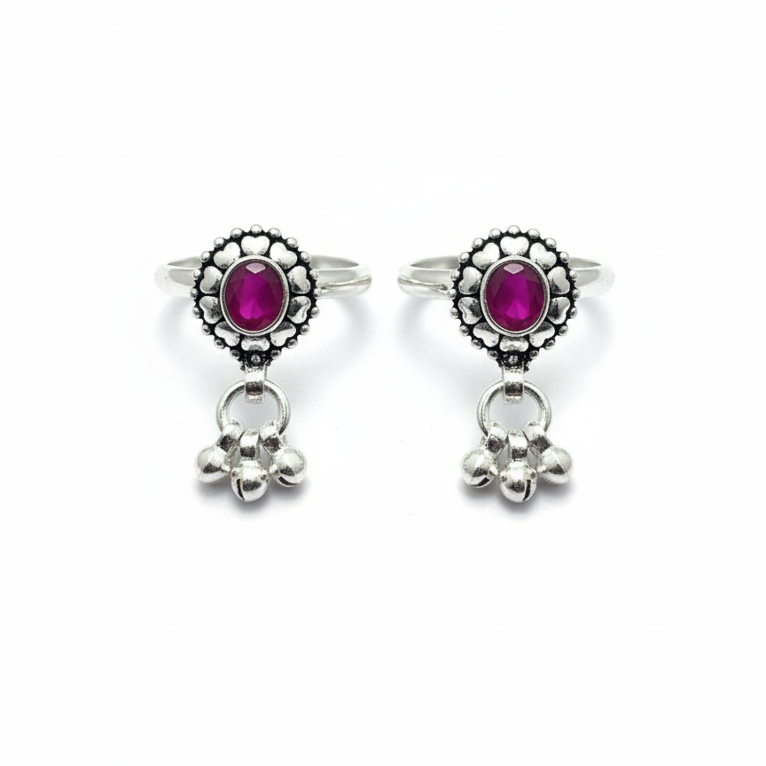 Pair of earrings with pink gemstones and silver accents on a white background